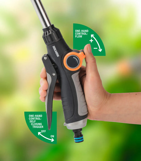 Hand holding Holman 8-Function Watering Wand 
